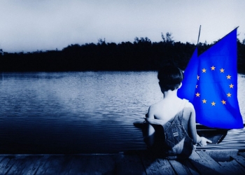 Child playing with a European boat