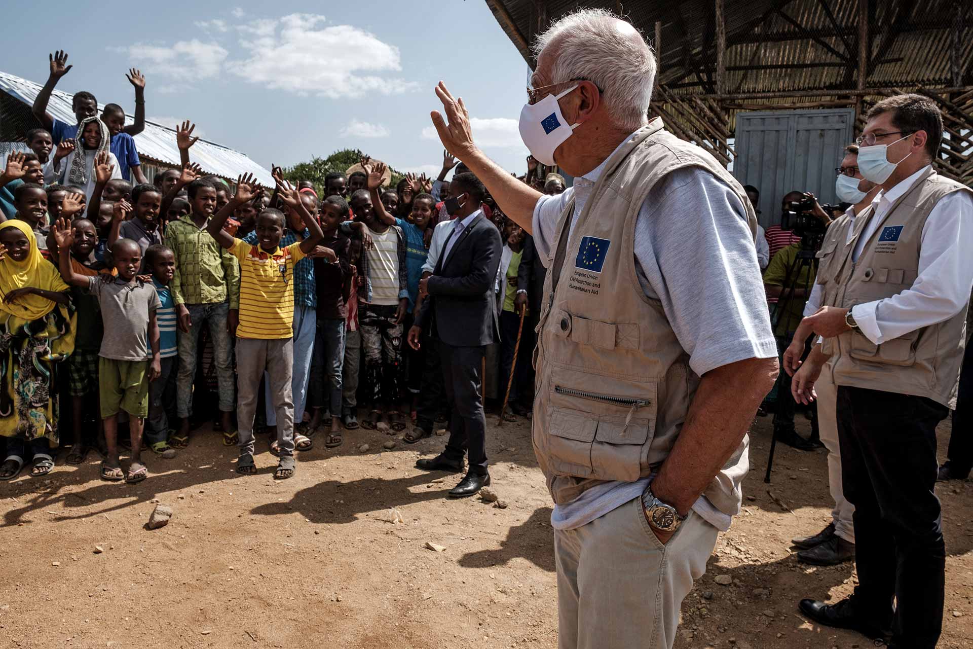 Africa: Josep Borrel, in the center, and Janez Lenarčič, on the right, greet the communities during a visit to the Qoloji Camp for Internally Displaced People, Ethiopia