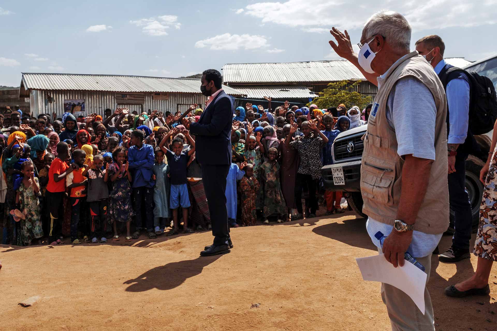 Josep Borrel, second right, greets the communities during a visit to the Qoloji Camp for Internally Displaced People, Ethiopia