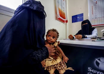 A mother with her severely malnourished daughter visits an EU-supported feeding centre in Yemen’s Lahij Governorate