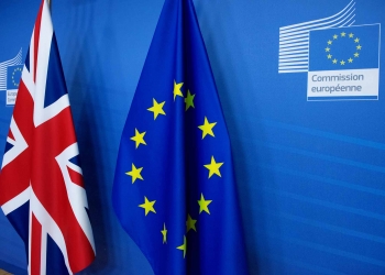 United Kingdom flag, on the left, and European Union flag