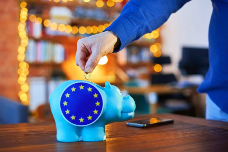 Savings, piggybank and EU flag