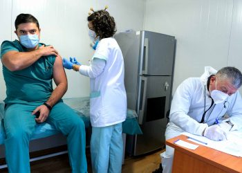 A medical worker getting vaccinated against COVID-19 in Bulgaria