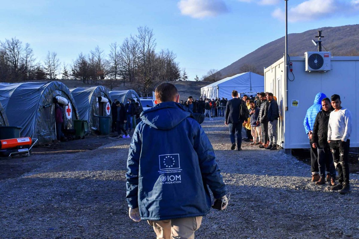 International Organization for Migration (IOM) walking in the Lipa camp for migrants