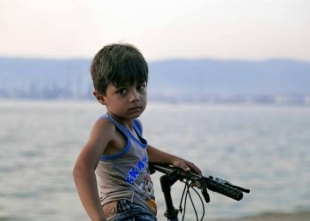 child in war in Syria