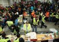 Volunteers preparing food for Ukrainian refugees arriving at Berlin Central Station